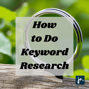 A magnifying glass with a n overlay text on how to do keyword research