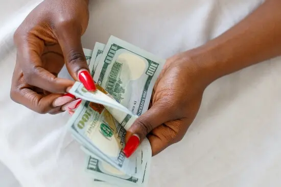 A blogger counting cash. This section is about how to start a Christian blog and make money blogging.