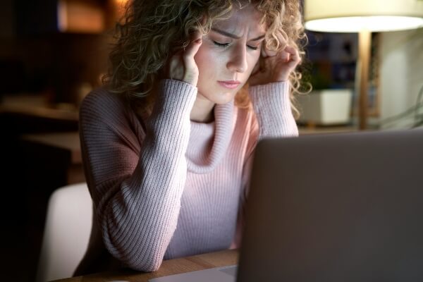 A frustrated female blogger wondering - Is blogging a good side hustle?